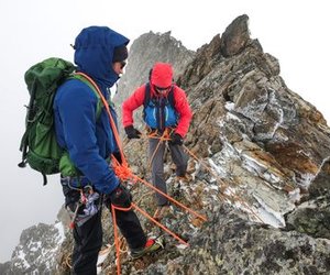 Mountaineers practise rope handling on a rock ridge
