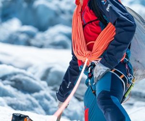 Mountaineer with rope tied around the upper body