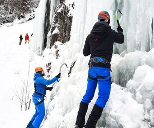 People ice climbing