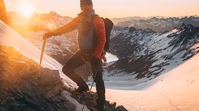 Mountain guide on the Oberaarhorn with sunrise in the background