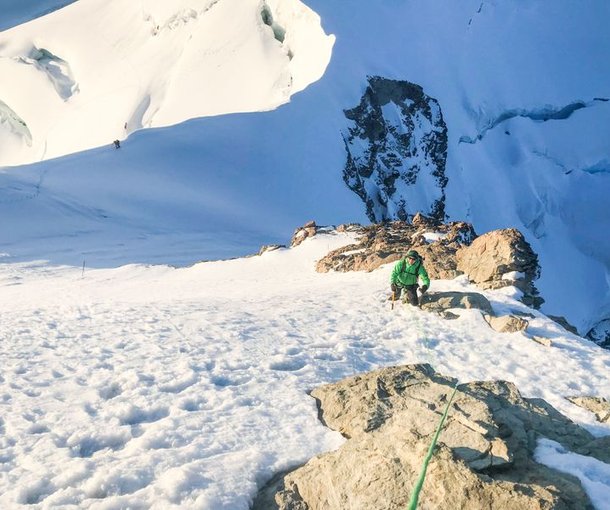 Mountaineer on the summit slope of the Jungfrau.