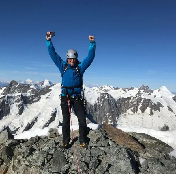 Climber on summit of Schreckhorn