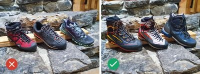 On the left, three pairs of low shoes, on the right, three pairs of high hiking boots on a stone floor.