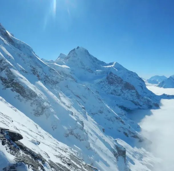View from the Eiger west flank of Jungfrau and sea of fog