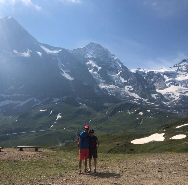 Hiker in front of Eiger, Mönch, and Jungfrau